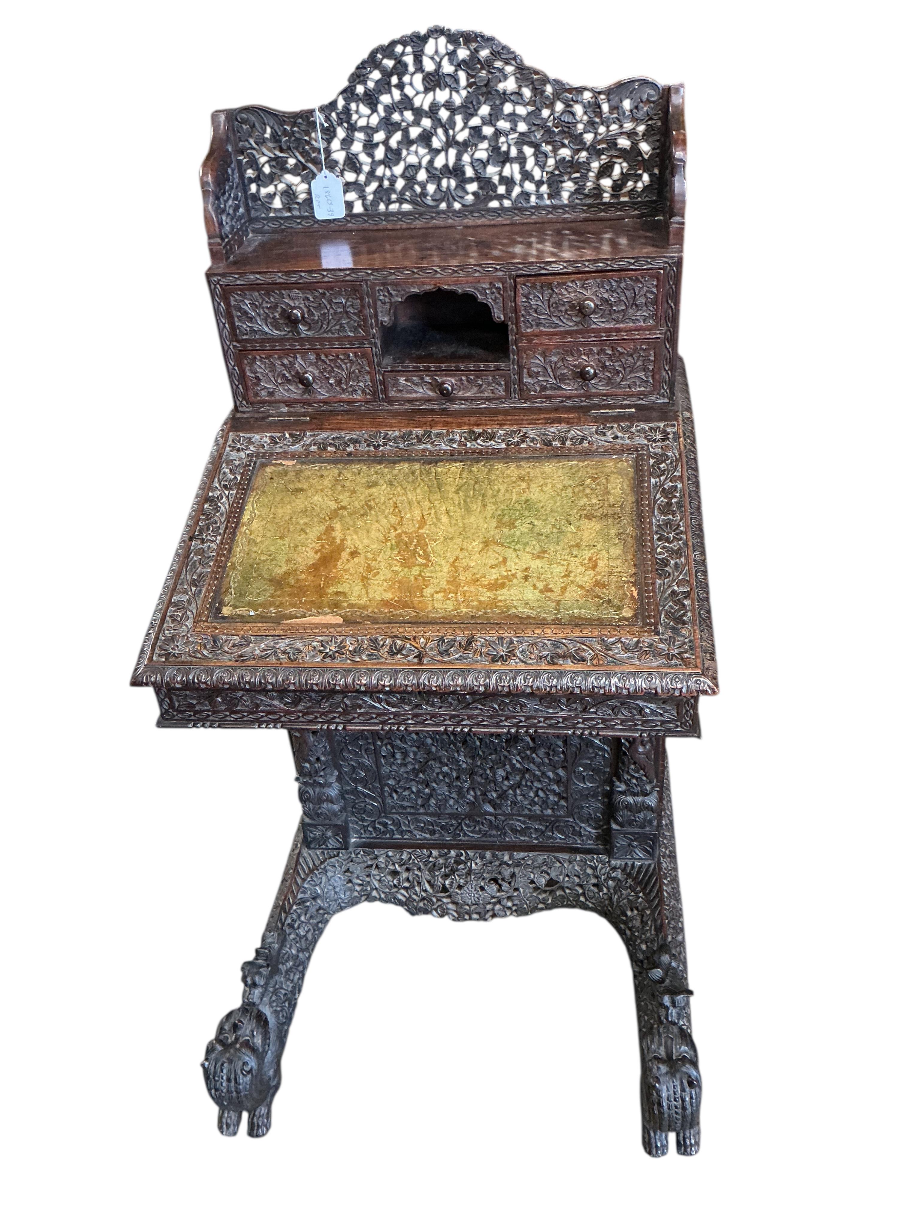 A 19th century Burmese carved hardwood Davenport, width 65cm, depth 67cm, height 122cm